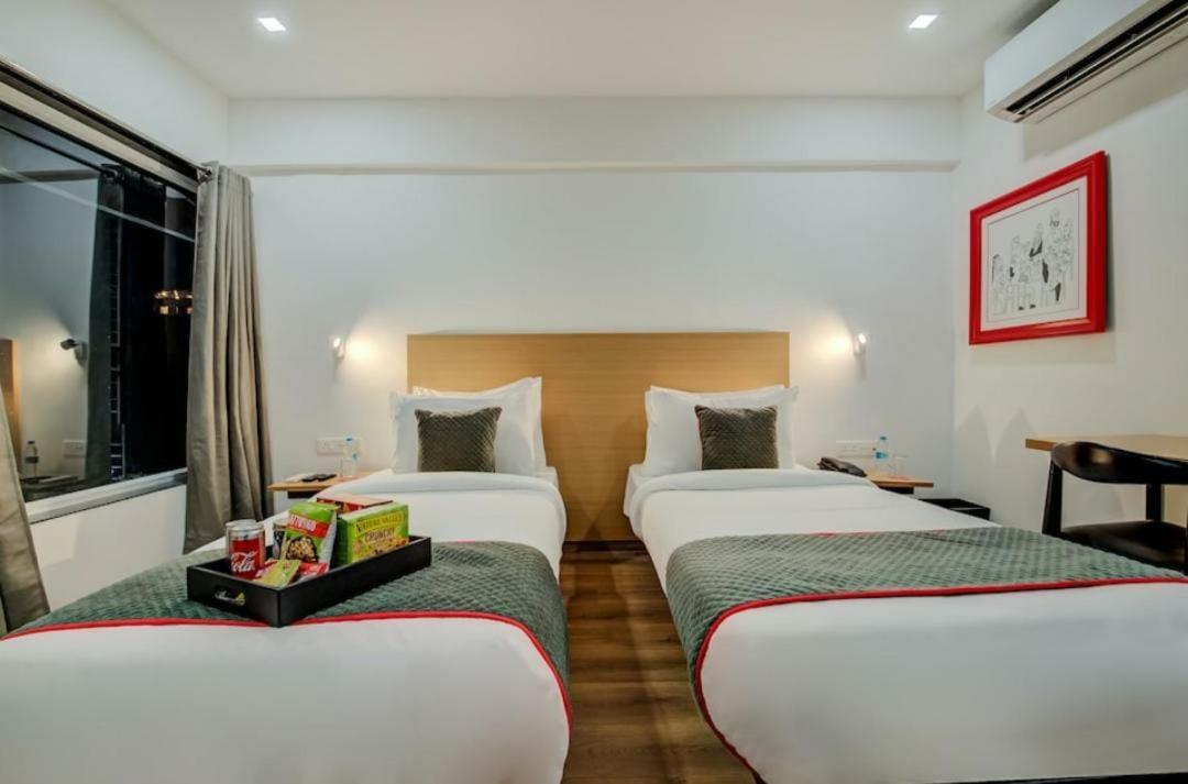 Hotel Town Plaza Púna Kültér fotó