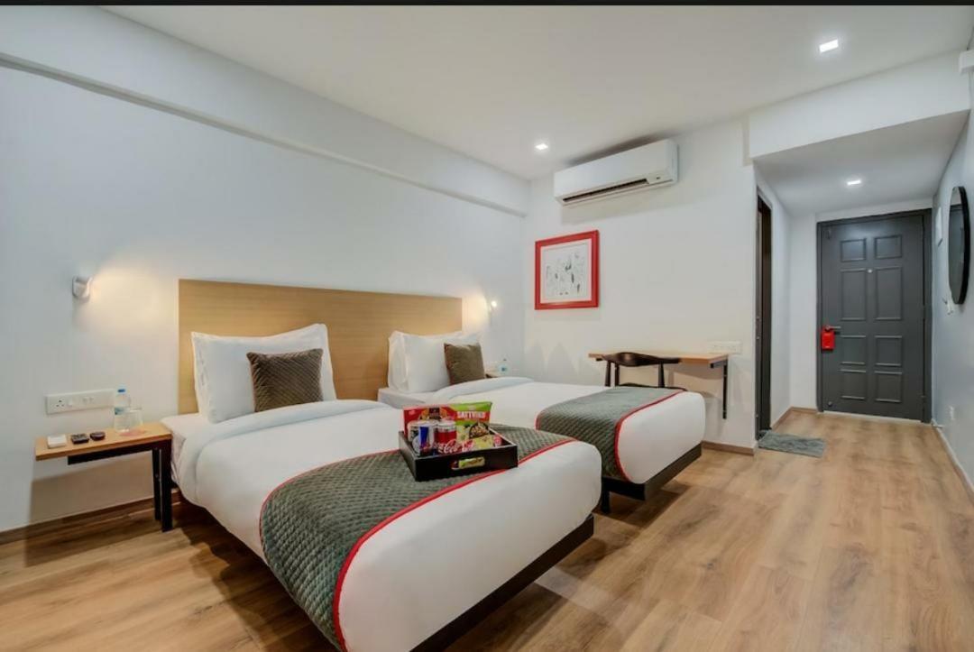 Hotel Town Plaza Púna Kültér fotó
